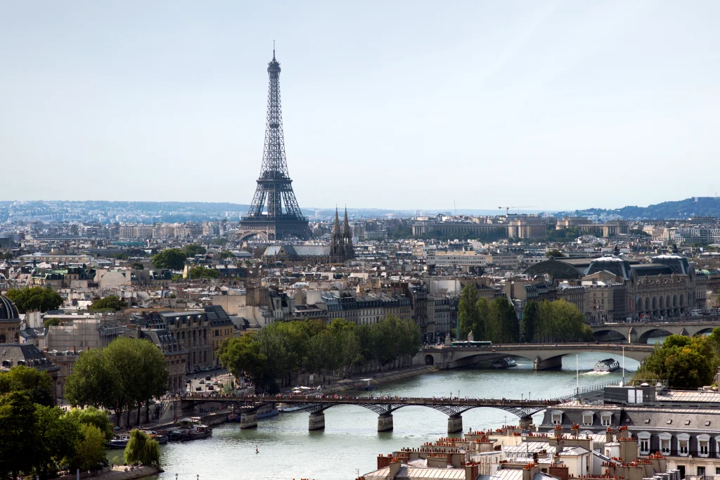 View over the rooftops of Paris and the Seine toward the Eiffel Tower